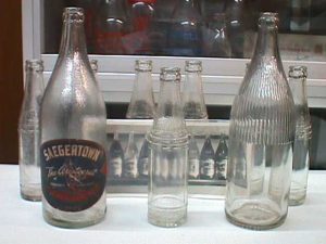 Group of embossed Saegertown bottles.