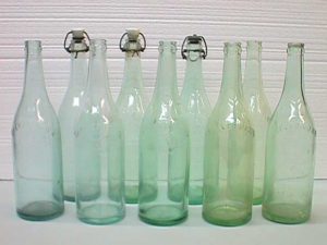 More embossed Saegertown bottles.